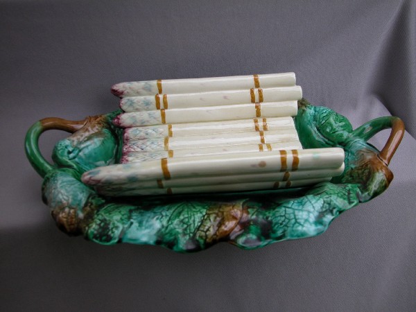 French majolica asparagus cradle on bed of bego: French majolica asparagus cradle on bed of begonia leaves, 15"