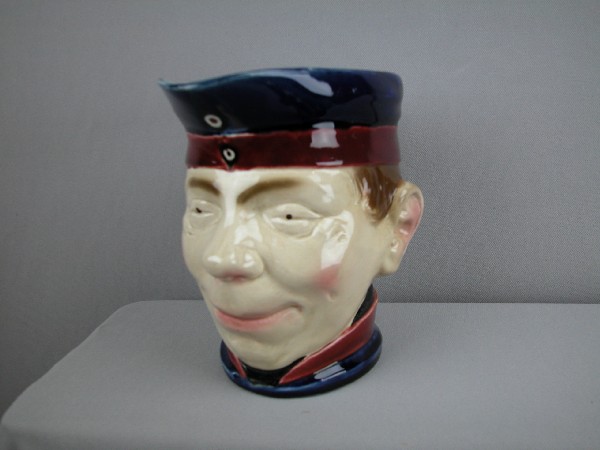 Sarreguemines "Soldier Allemand" figural face jug: Sarreguemines "Soldier Allemand" figural face jug, no. 4306, 7", rare, professional hairline repair