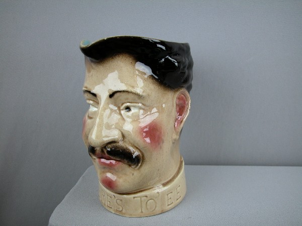 Sarreguemines "Here's To "E" figural face jug, ve: Sarreguemines "Here's To "E" figural face jug, very rare, 8", hairline, no. 3450
