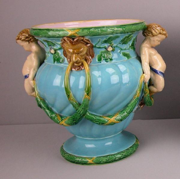 MINTON majolica jardiniere or wine cooler with tu: MINTON majolica jardiniere or wine cooler with turquoise ground, putti handles, lion masks and festoons, shape no. 1018, 10 1/2"