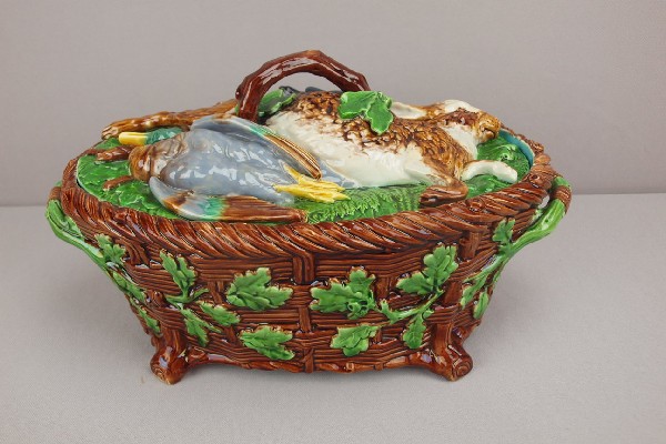 MINTON game tureen with rabbit and game on bed : MINTON game tureen with rabbit and game on bed of leaves and fern atop a basket weave base decorated with oak leaves and acorns, professional rim and handle repair to lid, 14 1/2"l