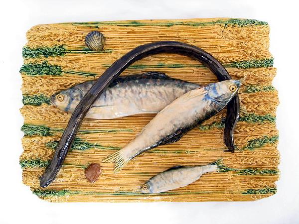 ALFRED RENOLEAU-POLAKOWKI circa 1889 French Pal: ALFRED RENOLEAU-POLAKOWKI circa 1889 French Palissy Ware platter modeled and applied with three fish, an eel and two shells resting on a bed of wheat, 16 1/2"l, outstanding color and detail, minor rim