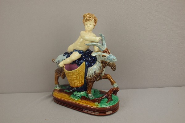 Figural majolica sweet meat server in the form o: Figural majolica sweet meat server in the form of a boy riding a goat, 10 1/2"h, 9"l, attributed to Minton or Holdcroft