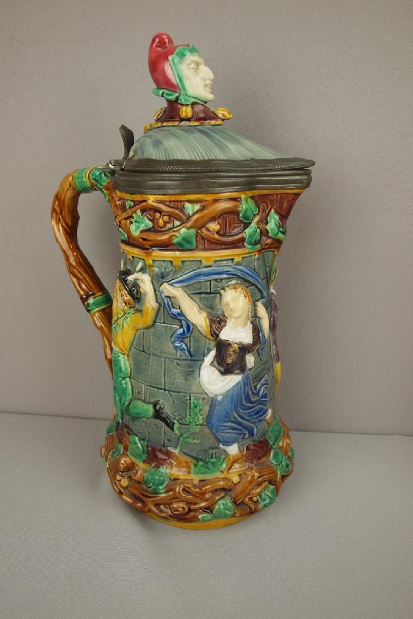 MINTON majolica tower jug with hinged top with: MINTON majolica tower jug with hinged top with jester finial, shape no. 1231, 13"h, professional repair to lid
