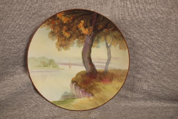 Nippon hand painted plate with sailboat on lake sc: Nippon hand painted plate with sailboat on lake scene, 8 3/4"