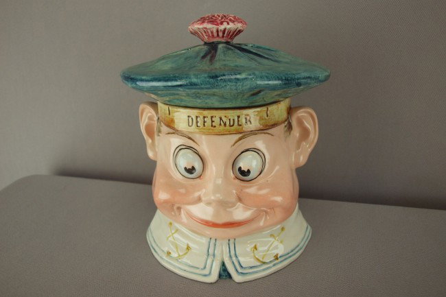 Palmer Cox Brownie "Defender" figural humidor, 6 1: Palmer Cox Brownie "Defender" figural humidor, 6 1/2"