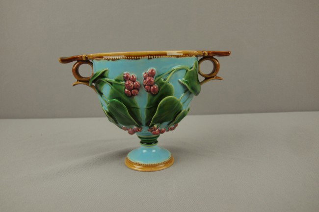 MINTON turquoise majolica two handled cup with iv: MINTON turquoise majolica two handled cup with ivy and berries, professional repair to tab handles, 4 1/4"