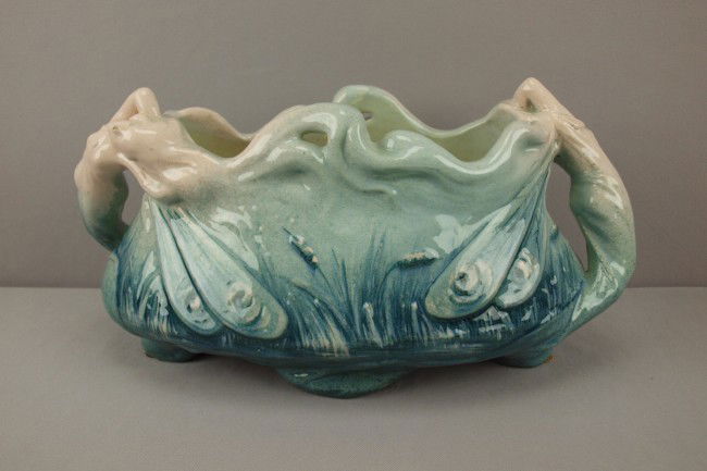 JEROME MASSIER rare table center in the form of an: JEROME MASSIER rare table center in the form of an oval bowl with winged fairy ends and handles, great detail, rare form, 16"l, 8"h, minor rim glaze nick