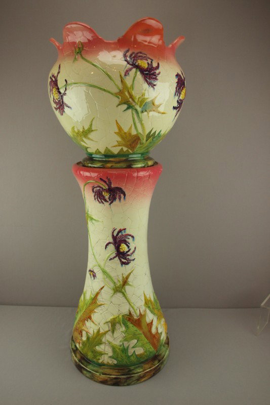 DELPHIN MASSIER majolica floral jardiniere and ped: DELPHIN MASSIER majolica floral jardiniere and pedestal , great color and detail, 36"h, 14 1/2"w, repair to rim of jardiniere, hairline to pedestal