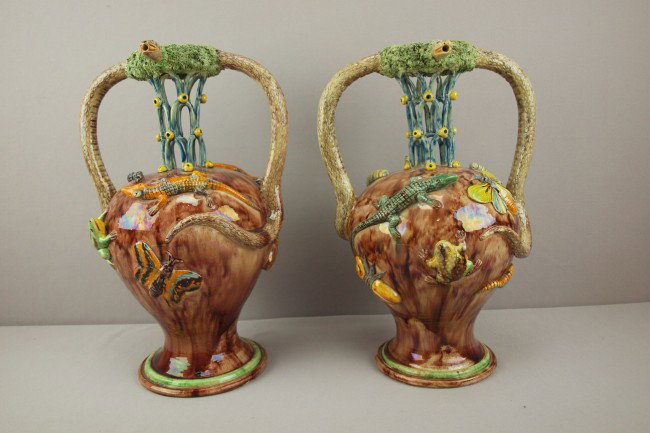 French majolica pair of Palissy Ware elaborate pu: French majolica pair of Palissy Ware elaborate puzzle vases each with large snake handles forming spouts and decorated with frogs, lizards, moths and other sealife on brown mottled ground, outstanding