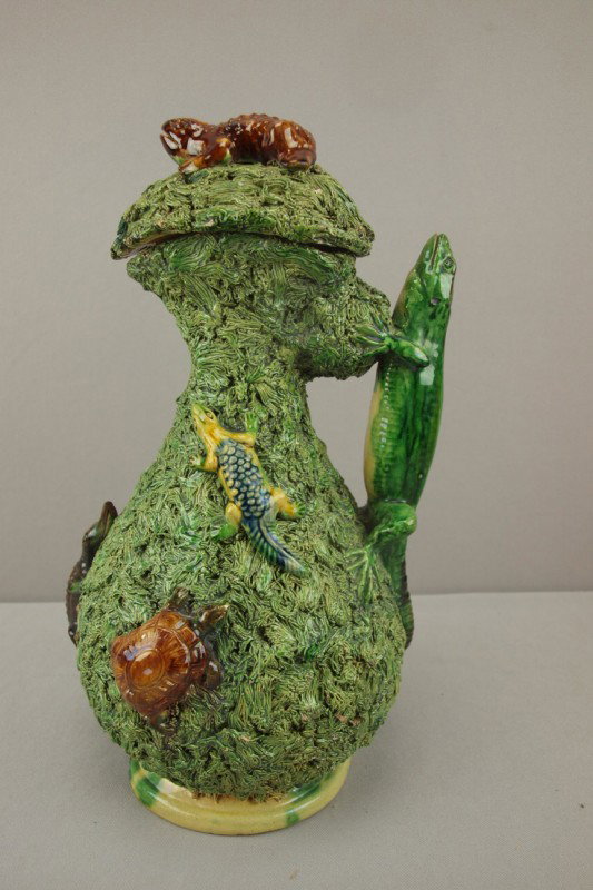 Portugal Palissy Ware large covered jug with toad : Portugal Palissy Ware large covered jug with toad on cover, lizard handle and base decorated with turtles and aligators on heavy green grass , nicks to high points and base chip, 14", nice detail