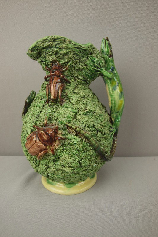 Portugal Palissy Ware pitcher with lizard handle a: Portugal Palissy Ware pitcher with lizard handle and applied creatures on heavy grass ground, 9"