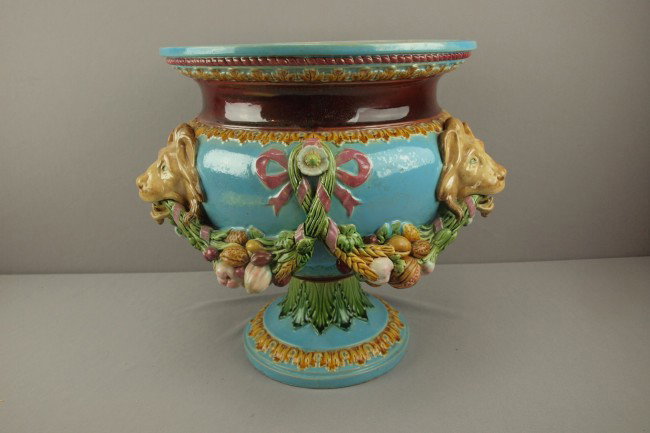 MINTON turquoise footed jardiniere with lions hea: MINTON turquoise footed jardiniere with lions heads connected by swag of nuts and fruit, various repairs, 16"w, 14 1/2"h
