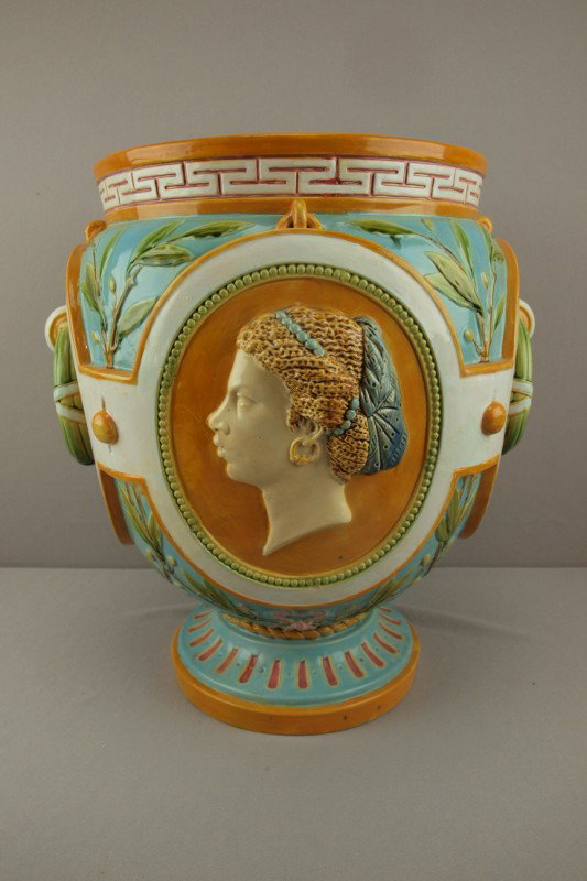 MINTON turquoise majolica jardiniere depicting Ame: MINTON turquoise majolica jardiniere depicting America and Africa, ref: Karmason- Stacke p. 38, professional rim repair, 17 1/2"h