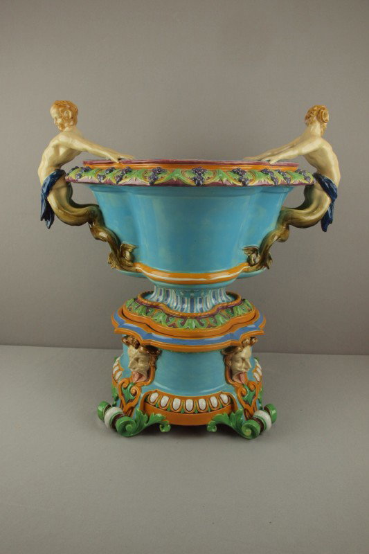 MINTON majolica monumental two piece wine cooler : MINTON majolica monumental two piece wine cooler on stand, modeled by Pierre-Emile Jeannest, formed in a quatrefoil bowl with mermen handles on matching pedestal with grotesque masks, professional rep