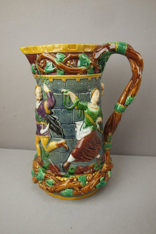 MINTON majolica tower jug with dancing figures in : MINTON majolica tower jug with dancing figures in high relief, professional repair to handle and spout, 9 1/2", shape no. 1231
