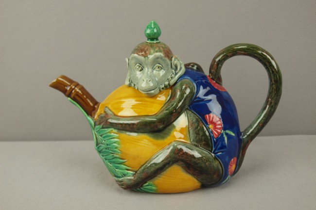 MINTON majolica figural teapot in the form of a mo: MINTON majolica figural teapot in the form of a monkey grasping a coconut, great color, detail and condition, 8 1/2"l, shape no. 1844
