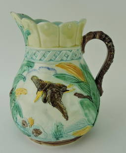 Majolica water lily and bird in flight: jug, 8 3/4"