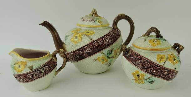 Majolica three piece floral and band: tea set, minor hairline to sugar