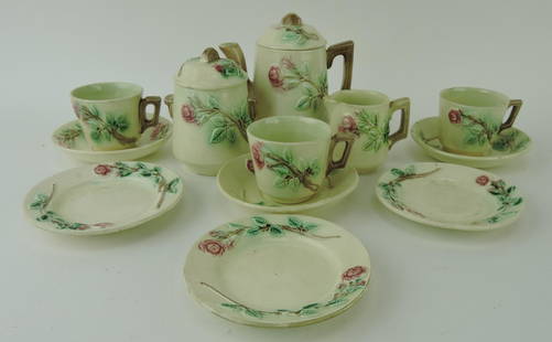 Majolica child's tea set: teapot, cream,: sugar, 3 cups/saucers, and 3 plates; various condition