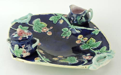 Majolica cobalt strawberry and blossom: strawberry server with creamer, sugar with lid, and 13" tray; professional repair to creamer