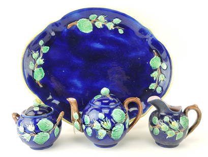 Majolica cobalt floral tea set with: 14 1/2" tray, teapot, creamer (professional repair), and sugar