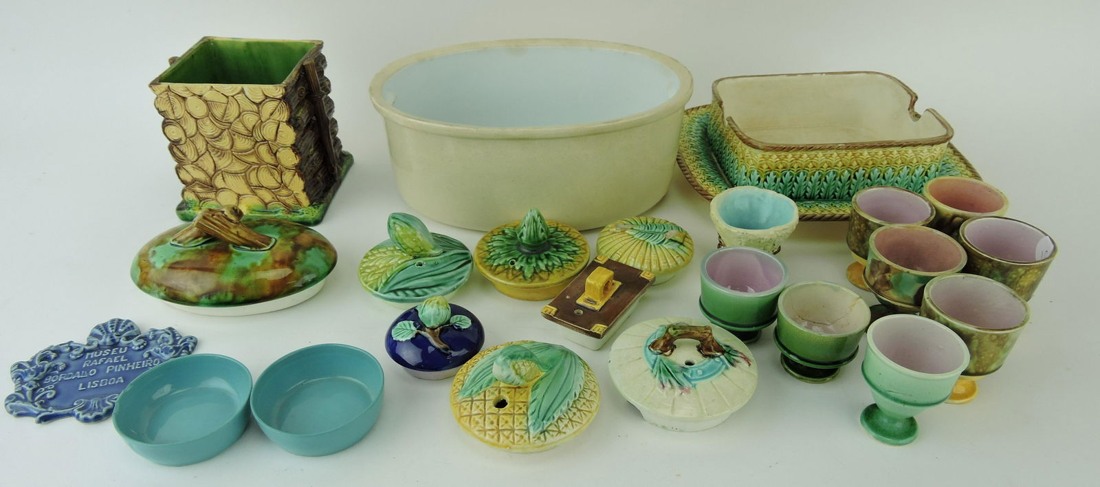 Majolica lot of lids, bases, liners,: egg cups, and more; various condition