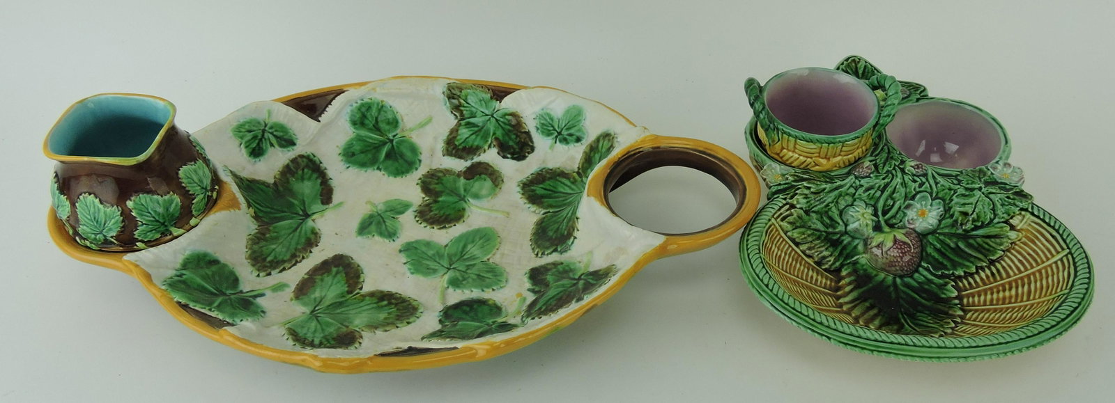 George Jones majolica lot of 2: strawberry servers, each missing a creamer or sugar