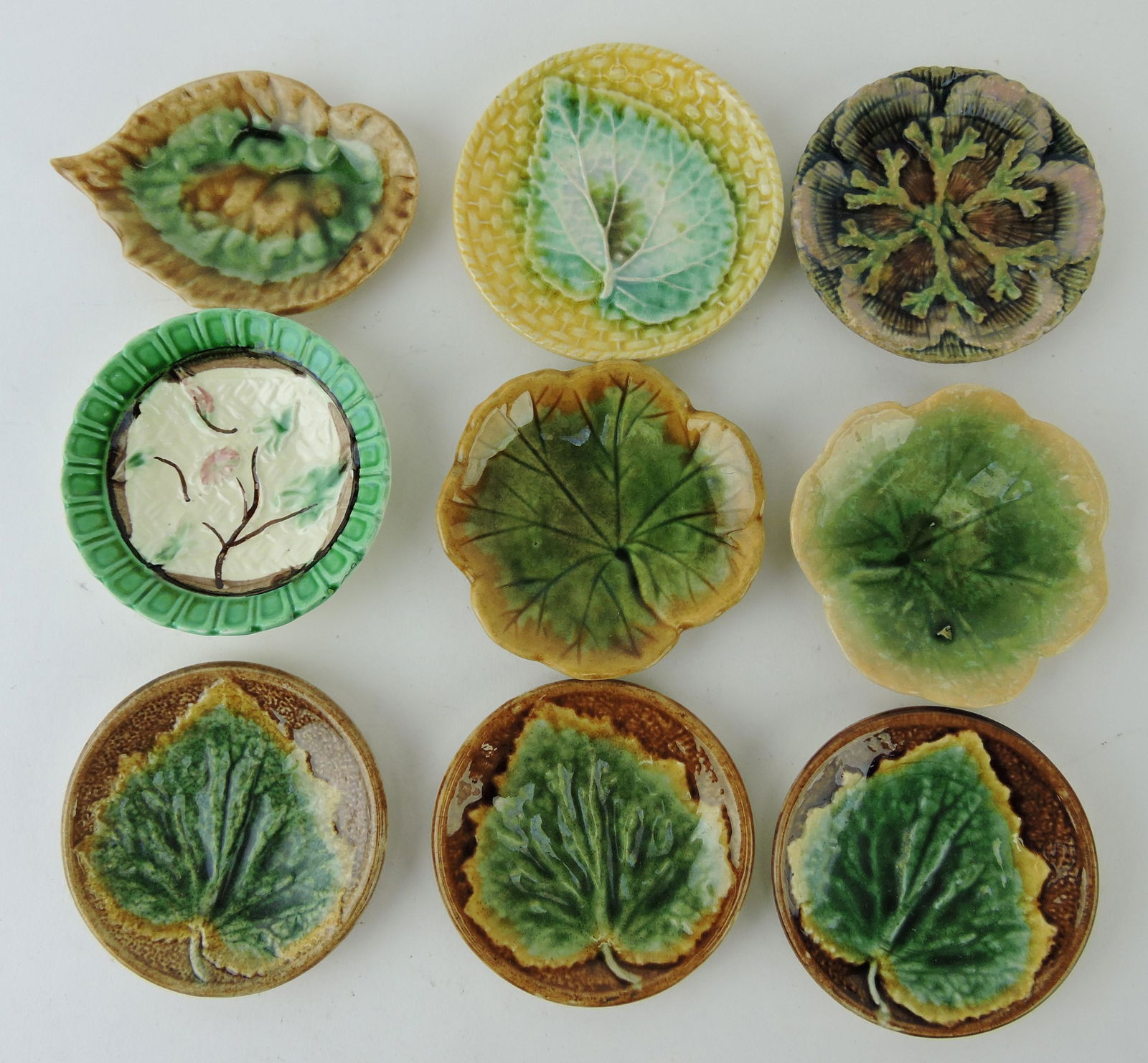 Majolica lot of 9 butter pats (1 of 1)