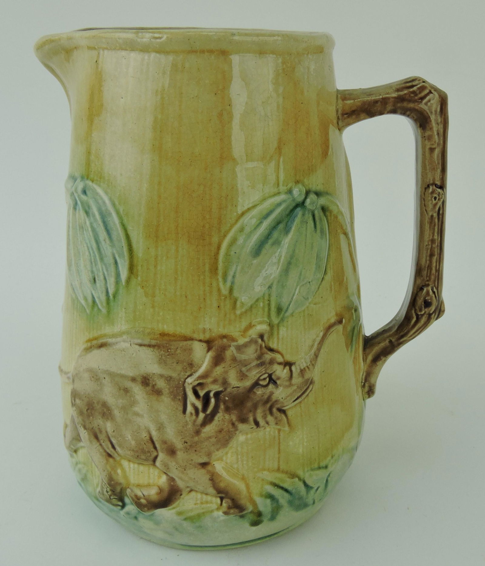 Majolica 7" 'Jumbo' pitcher with elephant,: rim repair
