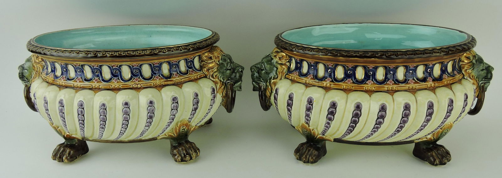 Rorstrand majolica pair of oval: cachepots, each with lion mask handles and paw feet, 13 1/2"w, 7"h