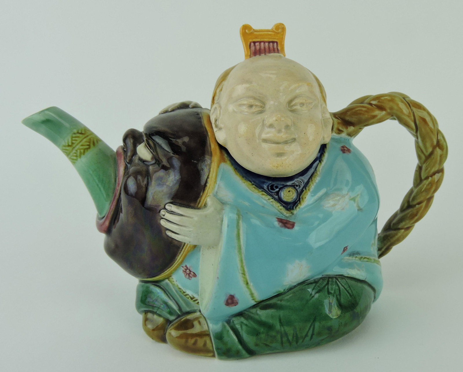 Minton majolica figural teapot in the: form of a Chinaman with mask, 7 1/2"l, 5 1/2"h; Betsy & Rick Porter Collection