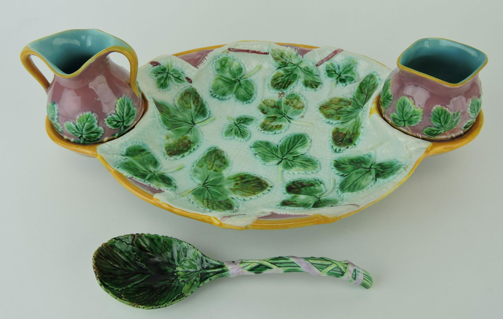 George Jones majolica napkin: strawberry server with cream, sugar, and serving spoon, 14 1/2", professional rim repair to cream and sugar