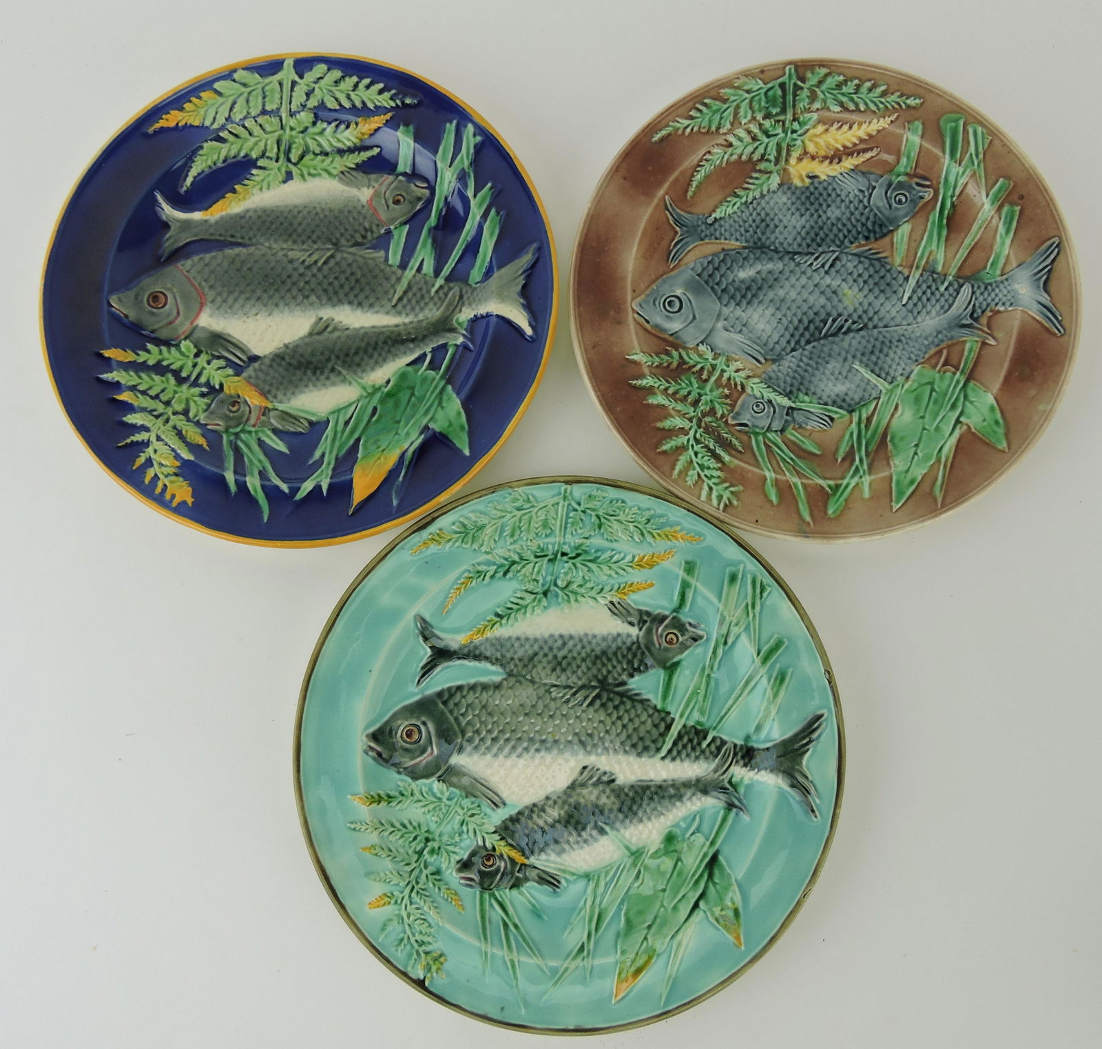 Wedgwood majolica lot of 3 - 9": fish plates, cobalt, turquoise, and brown,