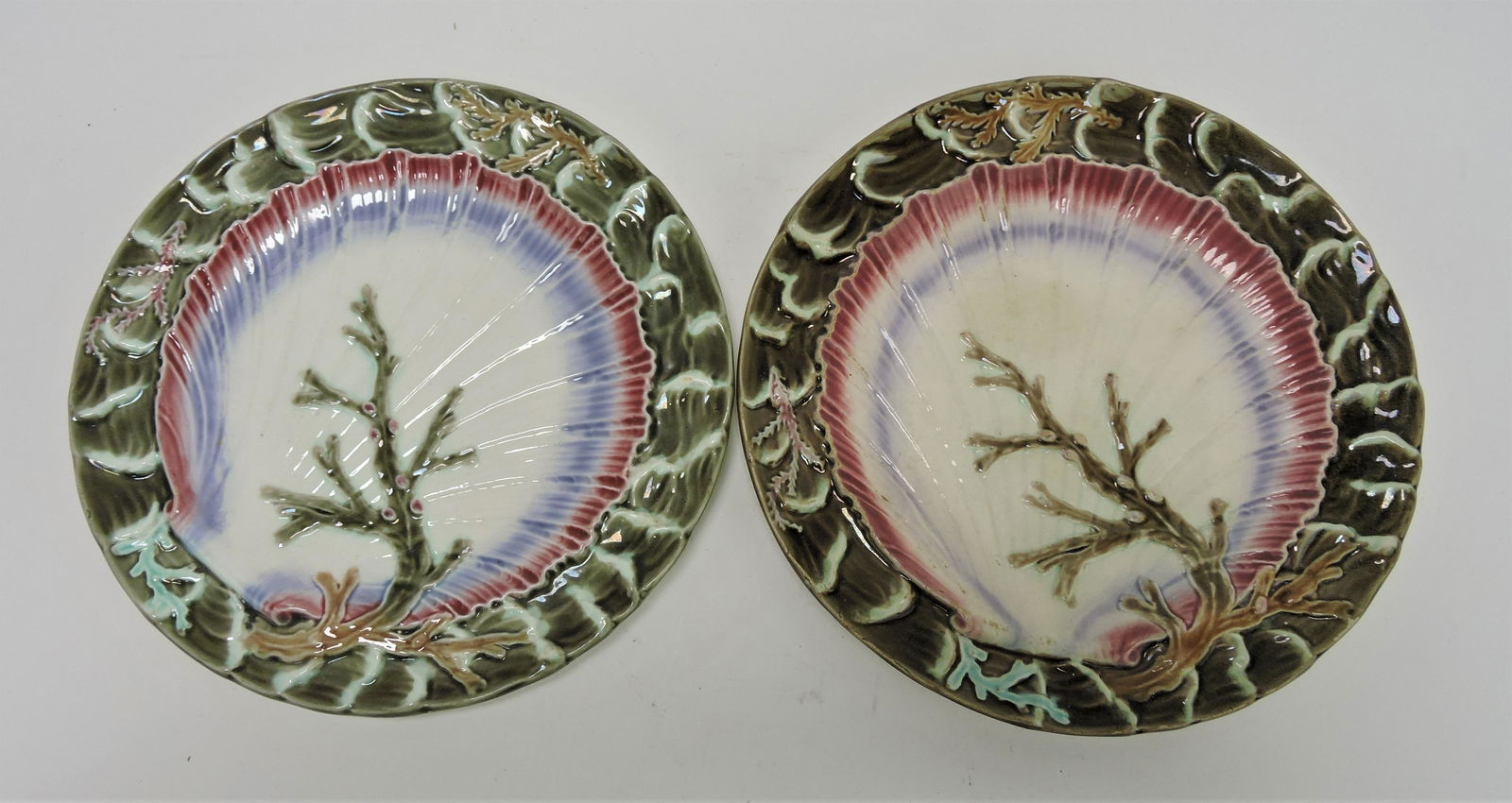 Wedgwood majolica pair of shell: and waves plates, 9", one with hairline and staining