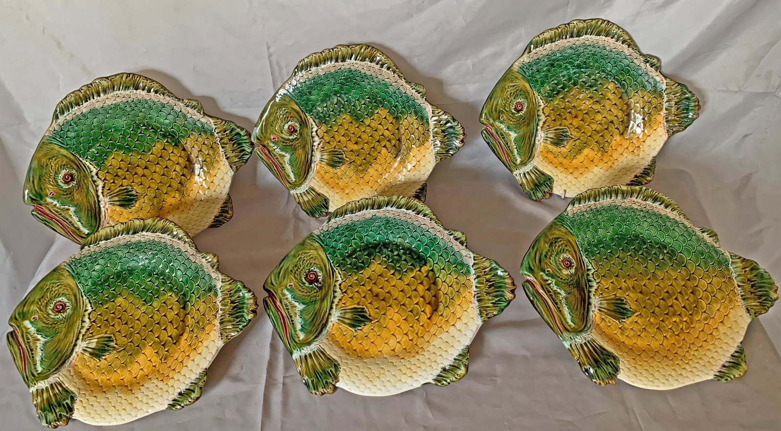 A set of six majolica fish plates, (1 of 3)