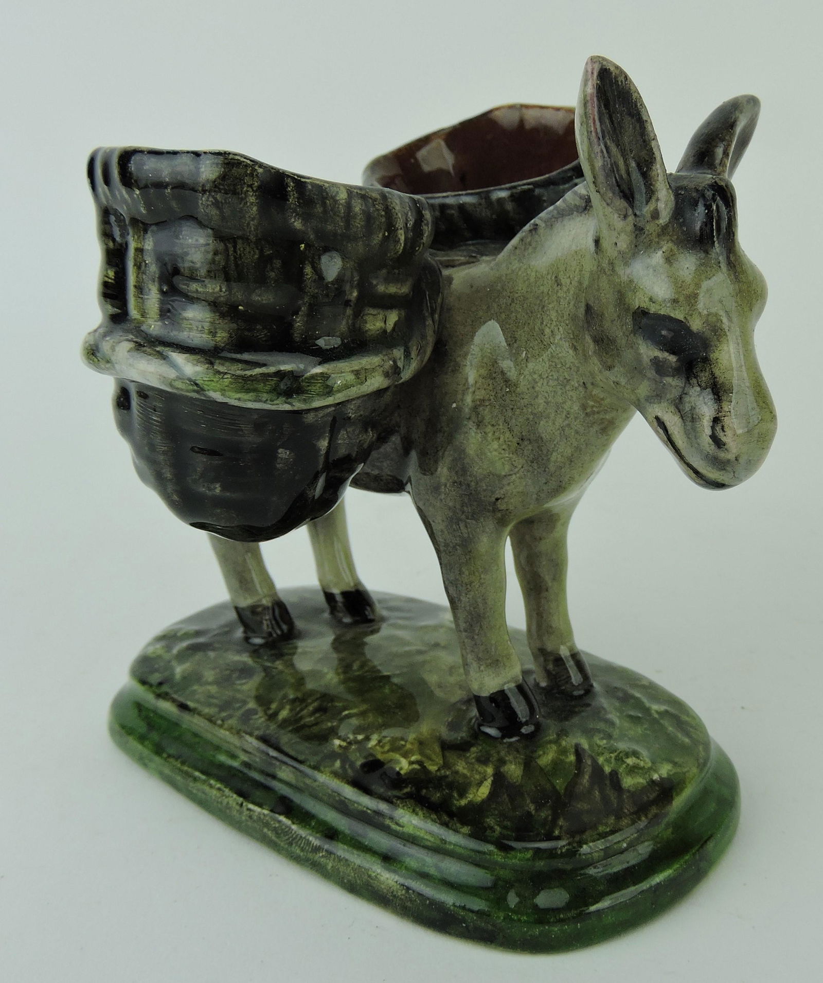 Clement Massier majolica figure of: a burrow with two backpacks toothpick holder