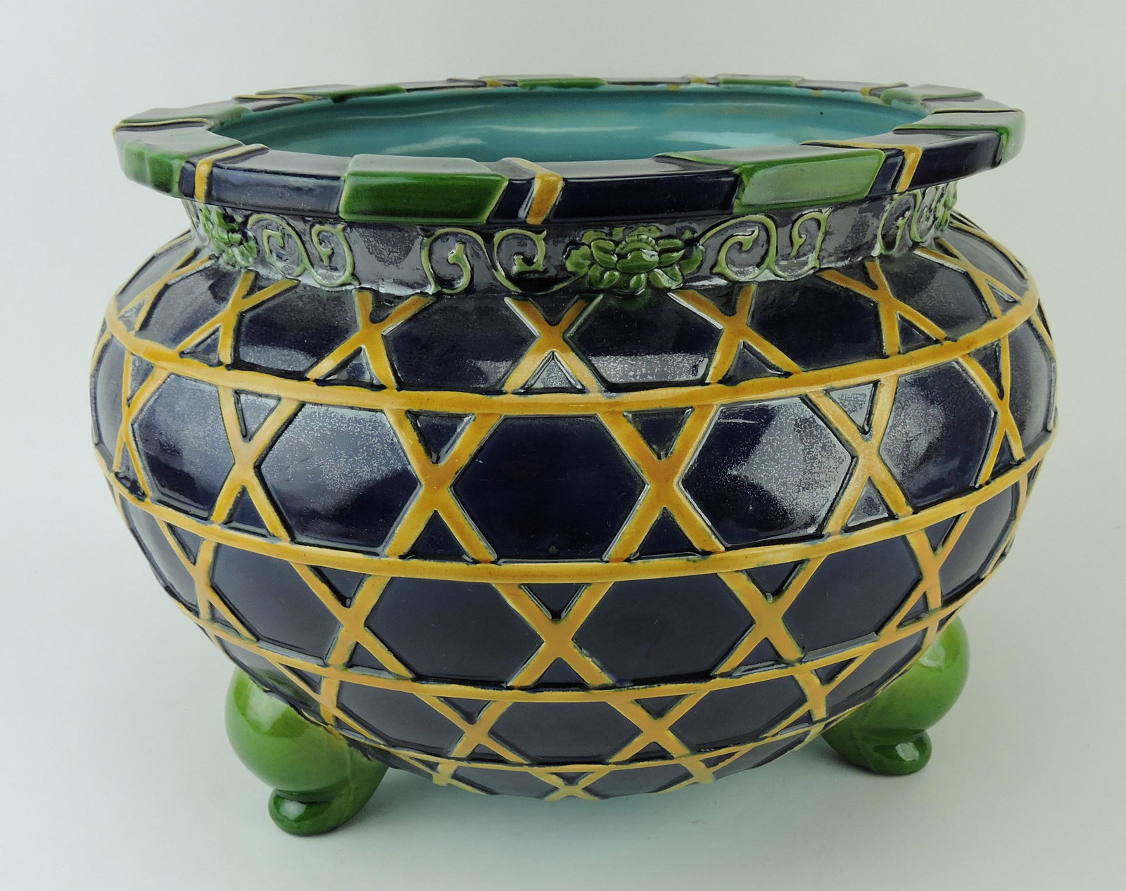 Minton majolica cobalt bulbous: jardiniere with yellow strapping, green feet, and accented rim, 11 1/2"h, 17"w, no. 2196, professional hairline repairs