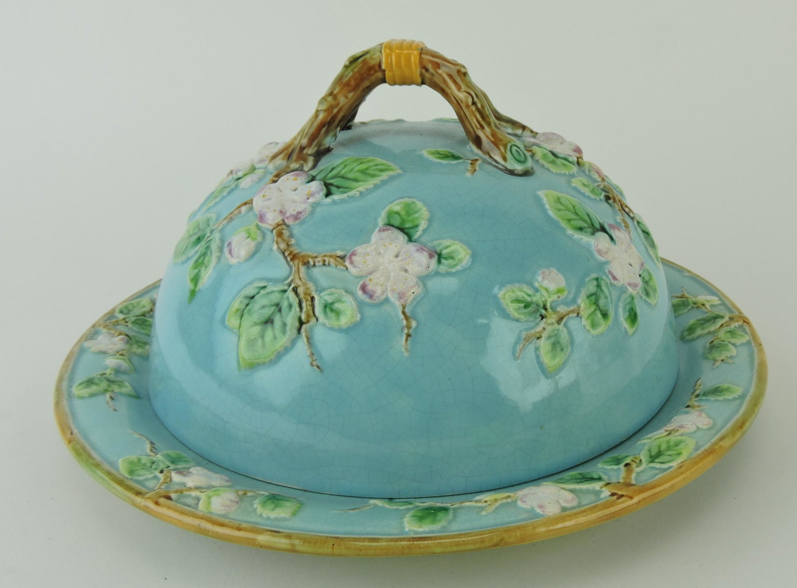 George Jones turquoise muffin: dis, apple blossom motif, branch handle, 6"h, 10 1/2"d