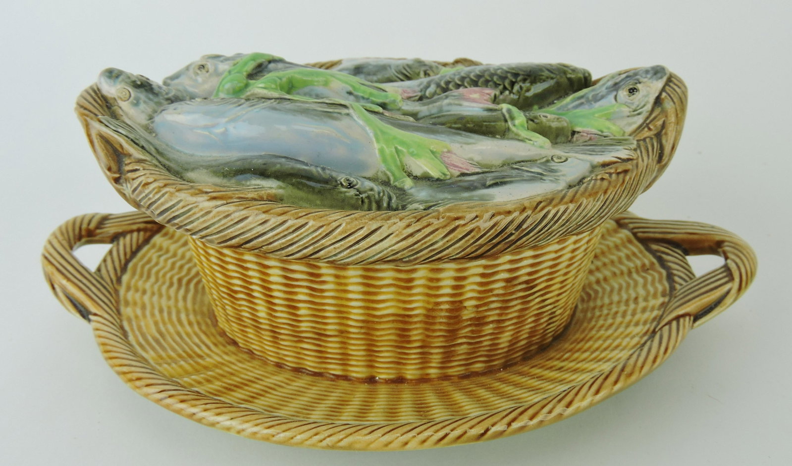George Jones majolica fishes in: basket sardine box, 8"w, 3 1/2"h; Betsy & Rick Porter Collection