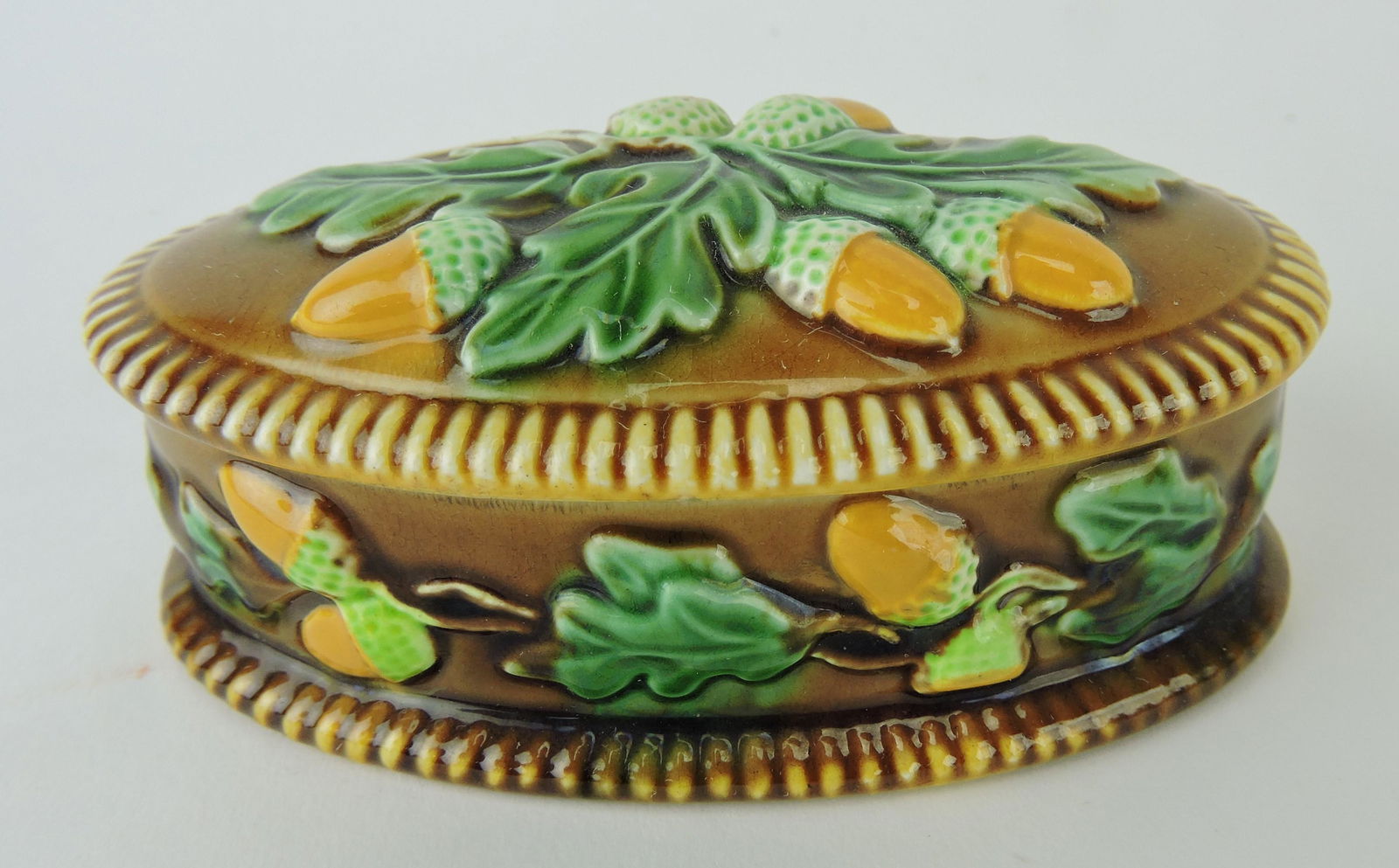 George Jones majolica oval matchbox: with oak leaves and acorns, 4"