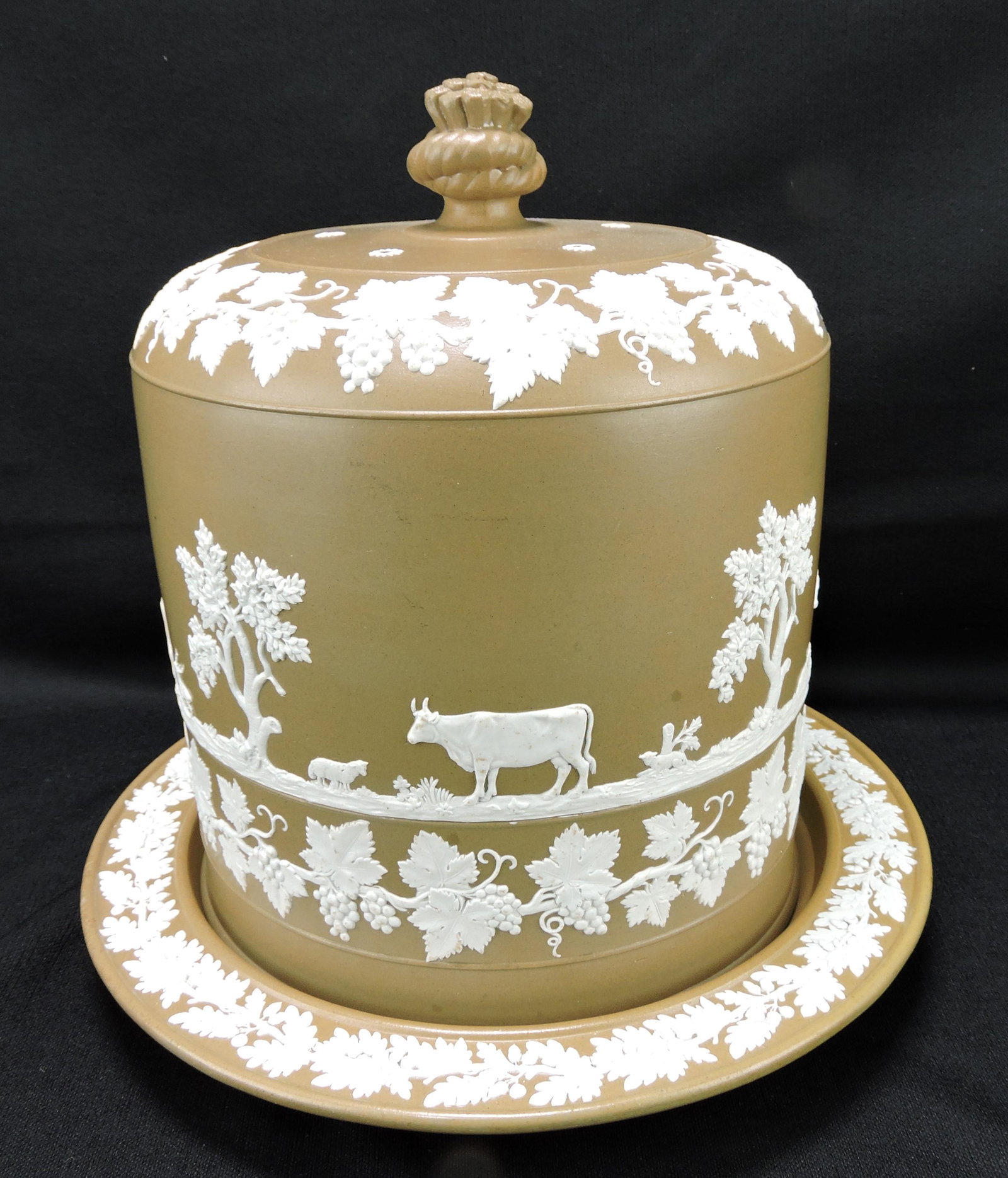 Brown and white Dudson cheese: keeper decorated with cows, dogs, goat, grape, and vine, 12"h, 12 1/2"d