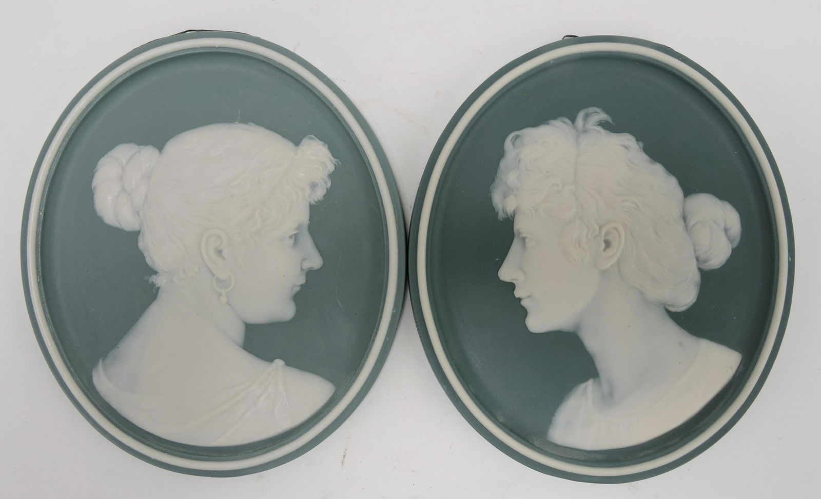 Mettlach pair of Pate-sue-pate: portrait plaques, 9"x7 1/2"