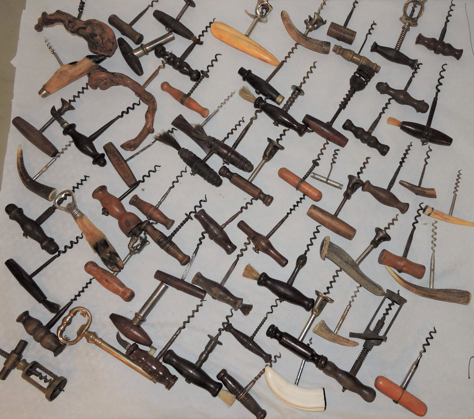 Collection of vintage corkscrews,: 62 pieces: wood handled, bone, horn, hoof, brass, and more; fine collection