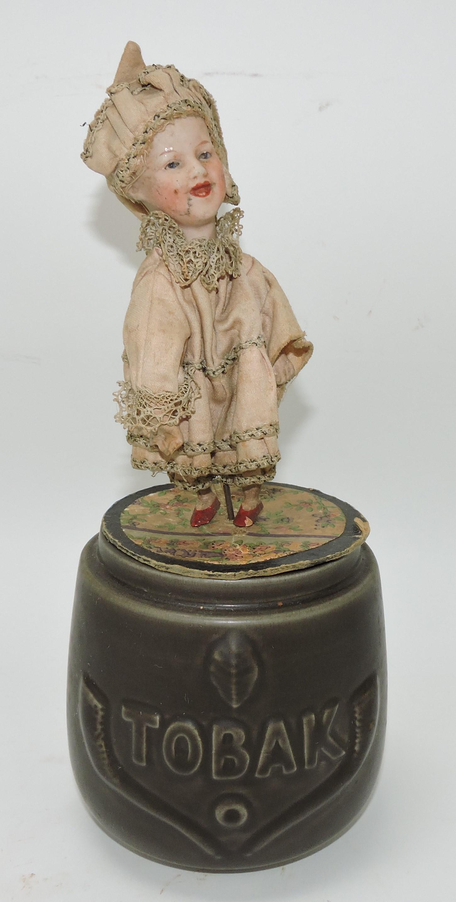 Mechanical bisque doll atop a humidor (1 of 1)