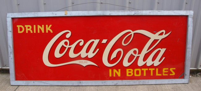 Coca Cola metal advertising sign, "Drink Coca Cola: Coca Cola metal advertising sign, "Drink Coca Cola in Bottles", 59" x 24", minor losses