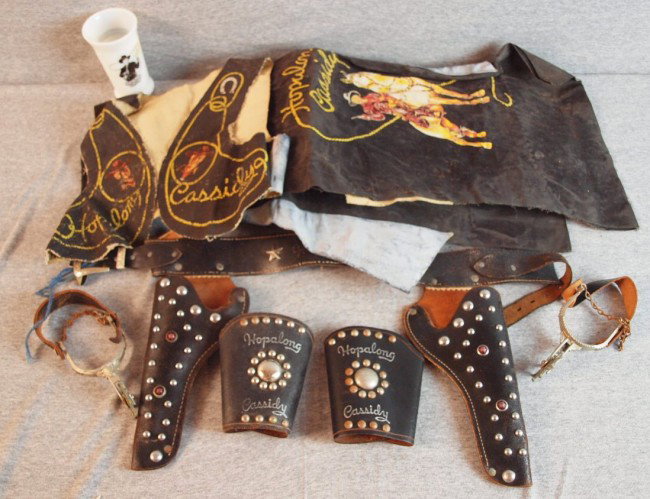 Hopalong Cassidy child's outfit with vest, pair of: Hopalong Cassidy child's outfit with vest, pair of chaps, pair of wrist cuffs, pair of boot spurs, holster set and milk glass tumbler, some wear