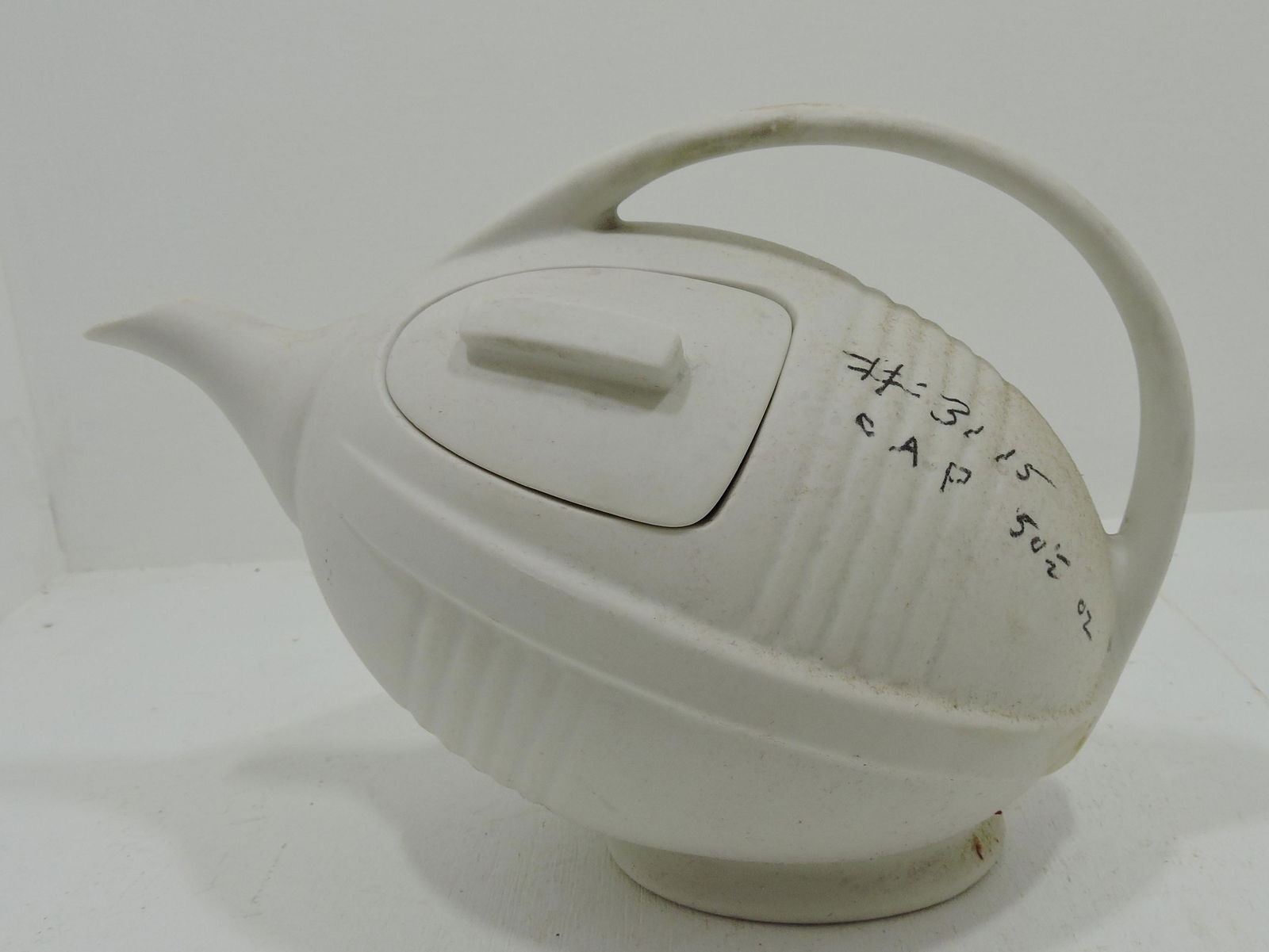 Hall China unglazed football teapot, (1 of 2)