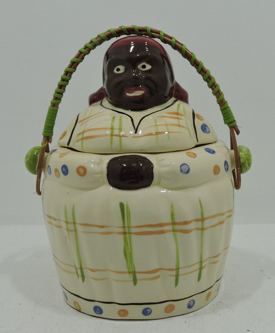 Black Americana Mammy cracker jar with wicker: handle, Japan, 7 3/4"