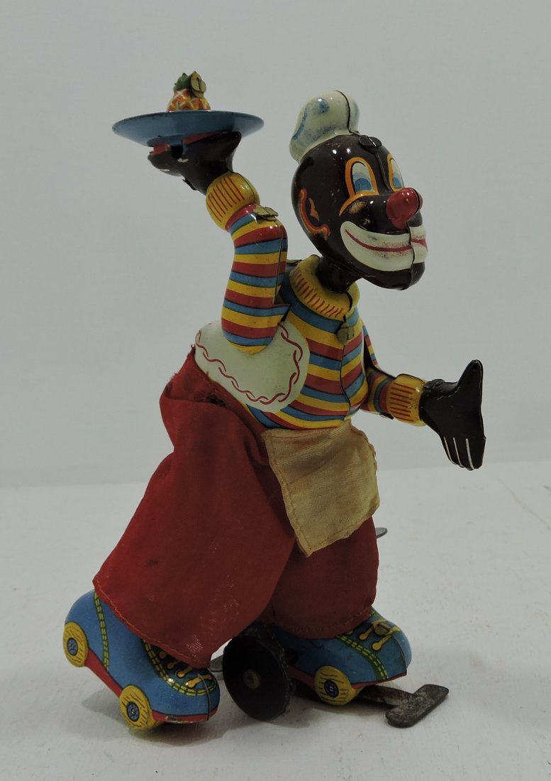 Japan tin litho waiter on skates wind up toy,: works, 6"